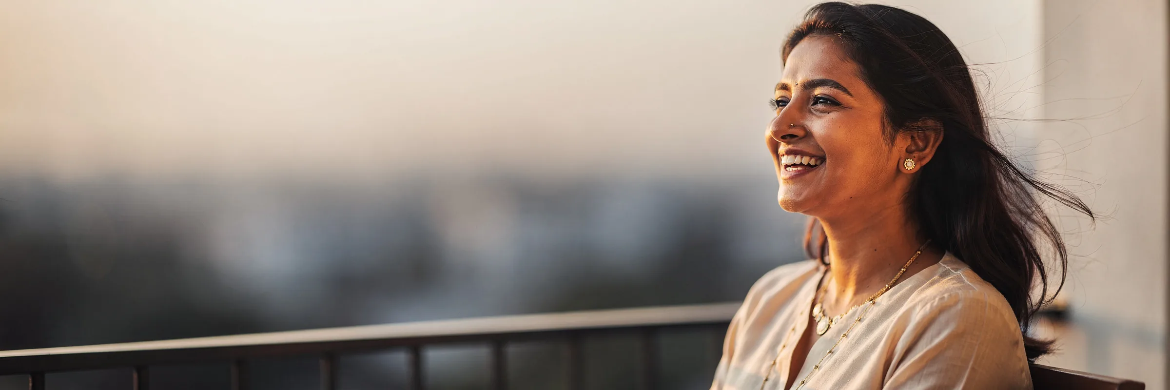 Illustrative picture: a woman laughing with a natural smile
